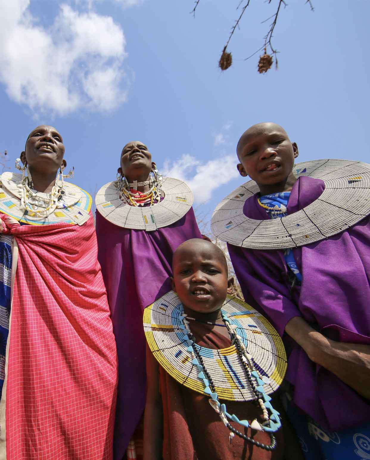 Group of Maasai smiling at the camera. 