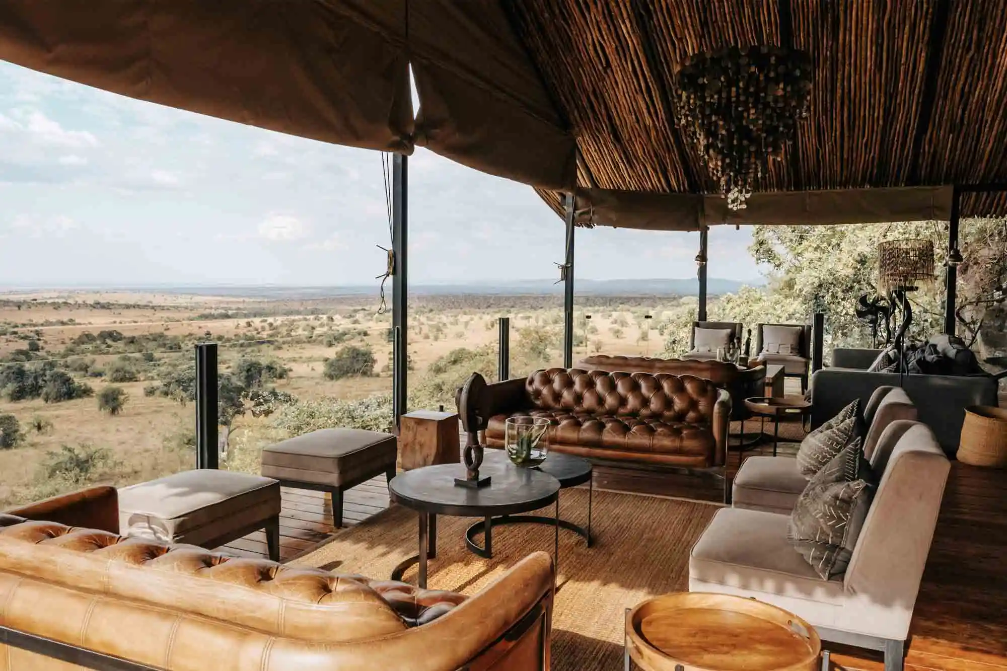 Picture of. the Serengeti lounge, with vintage chairs and an amazing view on the Tanzanian bush.